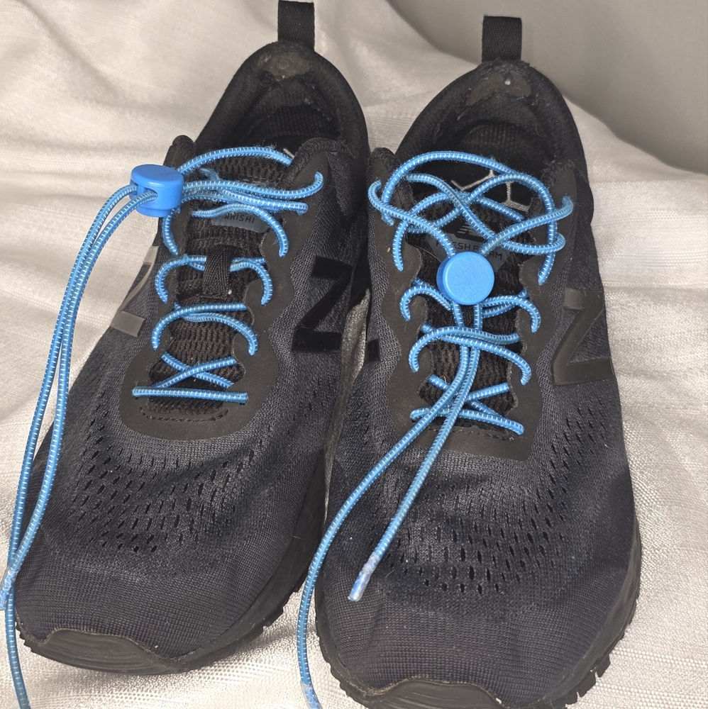 New Balance Black Sneakers with Blue Accents